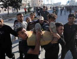 Palestinians carry the wounded people who were shot by the Israeli army an aid massacre at a Gaza Humanitarian Foundation site in central Gaza, May 30, 2025. (Photo: Moiz Salhi/APA Images)