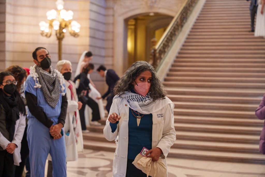 Dr Rupa Marya coordinates a vigil in SF City Hall, honoring Gaza’s healthcare workers who were killed by Israel. (Photo: John Avalos)