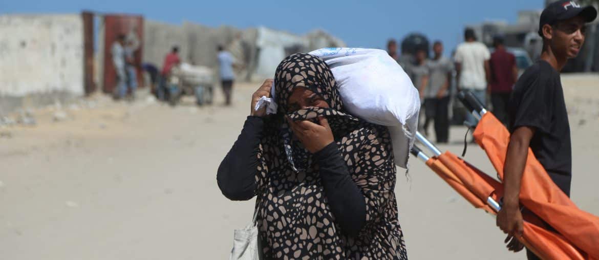 Palestinian women come back from GHF distribution center in southern Gaza, where eyewitnesses say GHF staff pepper-sprayed the aid-seekers and beat them with batons, July 24, 2025. (Photo: Abdallah Alattar/APA Images)