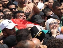 Mother of Palestinian martyr Ibrahim Nabulsi during his funeral. Nabulsi was one of the early founders of the Lions' Den in Nablus, and was assassinated on August 9, 2022. (Photo: Wajed Nobani/APA Images)
