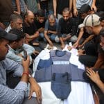 Palestinians mourn over the body of Al Jazeera correspondent Anas al-Sharif, who was killed alongside other journalists in an overnight Israeli strike on their tent in Gaza City, August 11, 2025. (Photo: Omar Ashtawy/APA Images)
