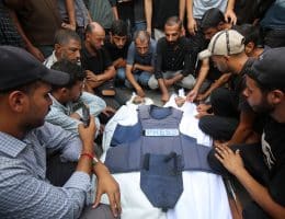Palestinians mourn over the body of Al Jazeera correspondent Anas al-Sharif, who was killed alongside other journalists in an overnight Israeli strike on their tent in Gaza City, August 11, 2025. (Photo: Omar Ashtawy/APA Images)