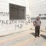 Palestinians inspect a burned-out mosque in the village of Aqraba, south of Nablus in the West Bank, after Israeli settlers set fire to the entrance and spray-painted Hebrew graffiti on the walls. (Photo: Mohammed Nasser/APA Images)