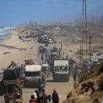 Palestinians arrive from Gaza City at Nuseirat refugee camp in central Gaza, following an Israeli announcement of the closure of the coastal al-Rashid road for anyone going back north. (Photo: Omar Ashtawy /APA Images)