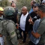 Israeli settlers, backed by army forces, attack a group of Palestinian and international activists taking part in an olive-harvesting event in the village of Soba, south of Hebron, on October 12, 2025. (Photo: Mamoun Wazwaz/APA Images)