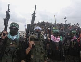 Members of the Qassam Brigades, the military wing of Hamas, during the handover of the bodies of the Bibas family and Oded Lifshitz to the Red Cross, February 20, 2025. (Photo: Omar Ashtawy/APA Images)