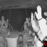 Activists onboard the Meteque, a ship that took part in the Global Sumud Flotilla, sit with their hands up on the deck as Israeli military forces illegally commandeer the boat in international waters. (Screengrab via Global Sumud Flotilla)