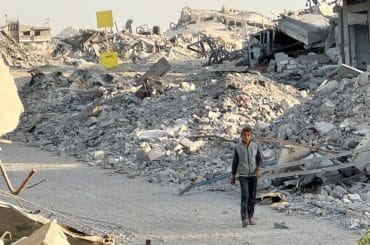 Israeli bulldozers and military vehicles have placed yellow-painted concrete blocks along what is known as the "yellow line" inside the Gaza Strip, marking a field boundary in areas from which Israeli forces withdrew on October 10 under the current ceasefire agreement, in Khan Younis on October 22, 2025. (Photo: Tamer Ibrahim/APA Images)