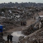 Palestinians whose homes were destroyed by Israeli attacks struggle with poor weather conditions as heavy rainfall floods Jabalia refugee Camp, November 25, 2025. (Photo: Omar Ashtawy/APA Images)