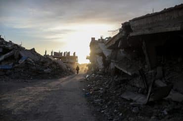 Displaced Palestinians continue their daily lives under difficult conditions inside displacement tents scattered amidst the destruction in the Zeitoun neighborhood, southeast of Gaza City, on December 9, 2025. (Photo: Omar Ashtawy/APA Images)