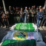Palestinians participate in the funeral procession for Raed Saad, a prominent commander in the Izz ad-Din al-Qassam Brigades, the military wing of Hamas, and three of his aides, who were killed in an Israeli airstrike in Gaza City, on December 14, 2025. (Photo: Omar Ashtawy/APA Images)