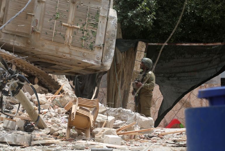 Israeli forces destroy a building after besieging it and killing five men inside during a raid on Tammun, May 15, 2025. (Photo: Mohammed Nasser/APA Images)