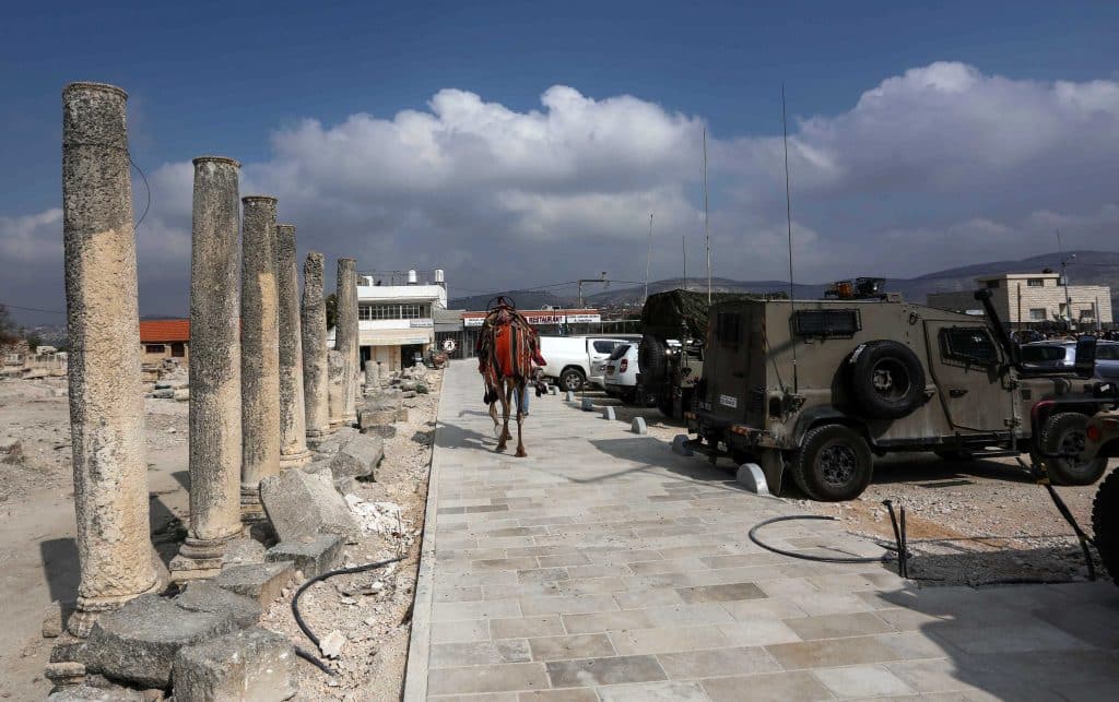 Israeli settlers visit the Roman-era basilica and amphitheater in the village of Sebastia, October 17, 2019. (Photo: Shadi Jarar'ah/APA Images)