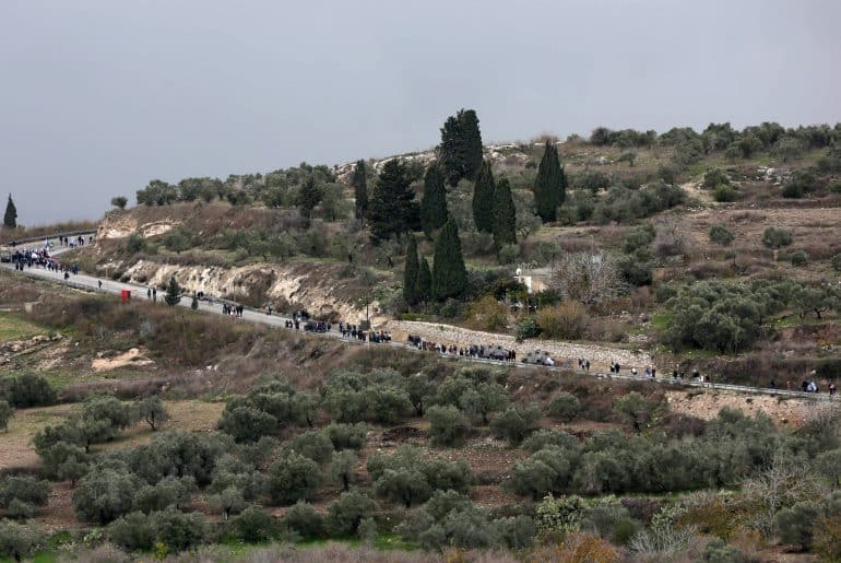 Israeli settlers return to the illegal Israeli outpost of Homesh, December 23, 2021. (Photo: Wajed Nobani/APA Images)