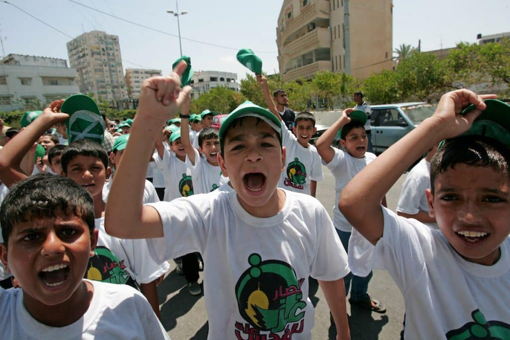Palestinian boys take part in a rally calling for an end to the siege on Gaza in front of the UN headquarters in Gaza City on July 07, 2009. (Photo: Naaman Omar/APA Images)