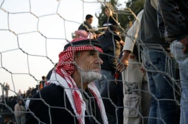 Palestinians stuck in Egypt wait to cross into Gaza at Rafah's border crossing, in the southern Gaza Strip. Egypt has warned Palestinians against trying to break through its resealed Gaza border about two weeks after Hamas militants blew it open to defy an Israeli-led blockade in January 2008. (Photo: APA Images)