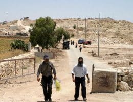 Israeli soldiers and police officers at the former Israeli military base, Ush al-Ghurab, at the edge of Beit Sahour outside of Bethlehem in February 2010. (Photo: Najeh Hashlamoun/APA Images)