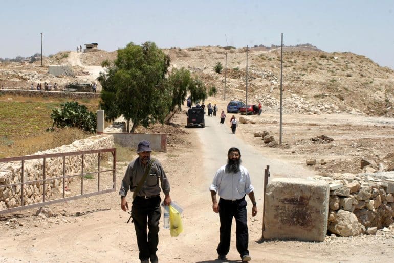 Israeli soldiers and police officers at the former Israeli military base, Ush al-Ghurab, at the edge of Beit Sahour outside of Bethlehem in February 2010. (Photo: Najeh Hashlamoun/APA Images)