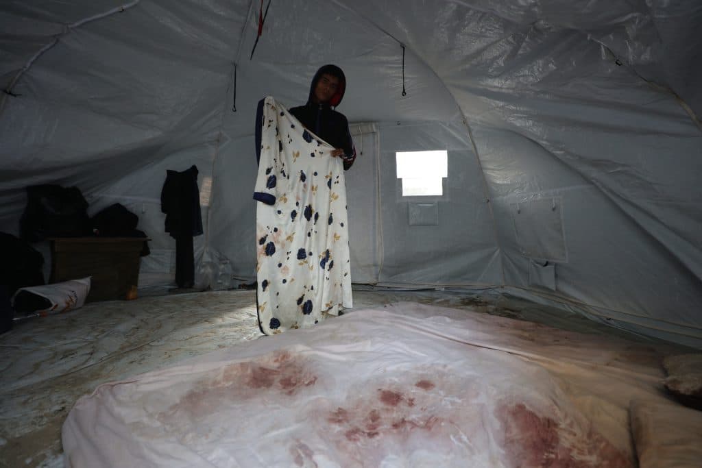 Ahmad Abu Saada in the tent where his wife, Walaa Juha, died in his arms three days after their wedding after a wall collapsed on their tent due to a winter storm, January 7, 2025. (Photo: Omar Ashtawy/APA Images)