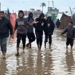 Palestinians struggle with flooding after heavy rain hits Deir al-Balah, central Gaza, December 11, 2025. (Photo: Ahmed Ibrahim/APA Images)