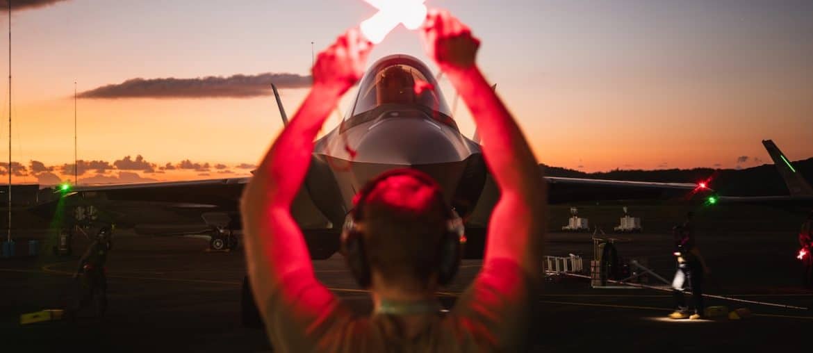 A U.S. Air Force crew chief guides a F-35A Lightning II following a large-scale strike against Venezuela, in Ceiba, Puerto Rico, January 3, 2026. (U.S. Air Force Photo)
