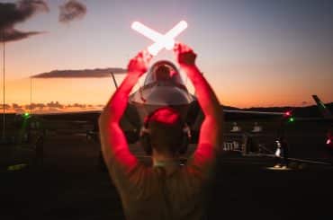 A U.S. Air Force crew chief guides a F-35A Lightning II following a large-scale strike against Venezuela, in Ceiba, Puerto Rico, January 3, 2026. (U.S. Air Force Photo)