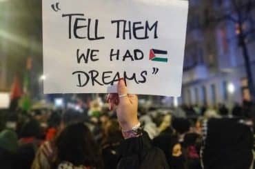 A photo taken at a protest in Berlin on December 13, 2024, a minute before the police attacked the crowd. The quote on the poster is attributed to Belal Aldabbour, a doctor in Gaza. (Photo: Nicola Mallardo)