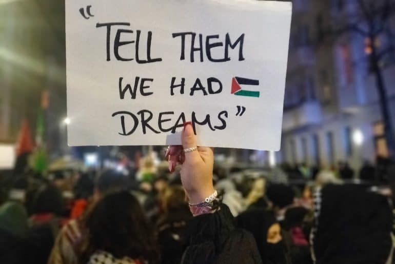 A photo taken at a protest in Berlin on December 13, 2024, a minute before the police attacked the crowd. The quote on the poster is attributed to Belal Aldabbour, a doctor in Gaza. (Photo: Nicola Mallardo)