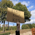 Sign at Raleigh protest (Triangle BDS)