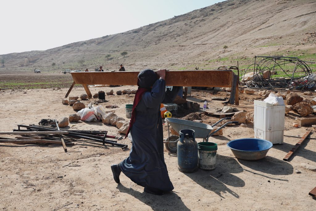 Palestinian Bedouin residents of Ras Ain al-Auja dismantle their homes as Israeli settlers forcibly expel them from their lands, January 2026. (Photo: Wahaj Bani Moufleh)