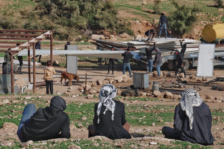 Palestinian Bedouin residents of Ras Ain al-Auja dismantle their homes as Israeli settlers forcibly expel them from their lands, January 2026. (Photo: Wahaj Bani Moufleh)