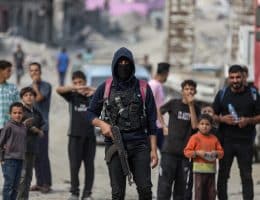 Al-Qassam Brigade team members oversee rubble removal in search of bodies of deceased Israeli captives, Baghdad Street, Shuja'iyya, November 3, 2025. (Photo: Omar Ashtawy/APA Images)