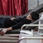 A large number of children arrive at Al-Awda Hospital in Nuseirat refugee camp in central Gaza due to the outbreak of a new coronavirus variant, January 18, 2026. (Photo: Moiz Salhi/APA Images)