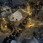 Palestinians gather between destroyed houses to break their fast together during the holy month of Ramadan in the northern Gaza Strip, February 22, 2026. (Photo: Omar Ashtawy/APA Images)