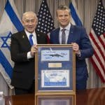 Secretary of Defense Pete Hegseth presents a framed photo of a B-2 Spirit stealth bomber and a map of Operation Midnight Hammer, launched against Iran on June 22, 2025, to Israeli Prime Minister Benjamin Netanyahu at the Pentagon in Washington, D.C., July 9, 2025. (DoD photo by U.S. Navy Petty Officer 1st Class Alexander Kubitza)