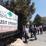 Students gather in front of the closed entrance of Birzeit University during a strike protesting rising tuition fees, September 2, 2013. (Photo: Issam Rimawi/APA Images)