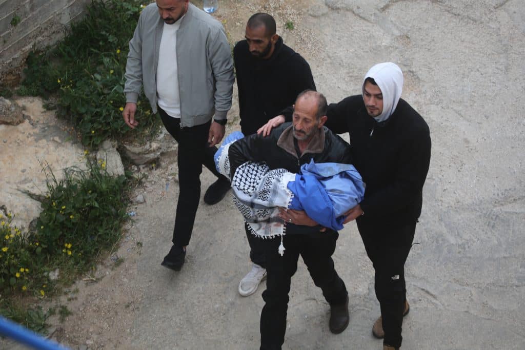 The bodies of the four slain members of the Bani Odeh family, including two children, were laid to rest in their hometown of Tammoun in the northern West Bank, days after being gunned down in their car by Israeli soldiers, March 15, 2026. (Photo: Mohammed Nasser/APA Images)