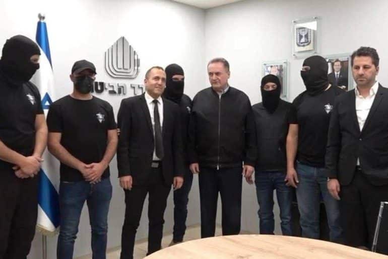 Israel Katz (center) meeting with the Sde Teiman rapists (wearing masks). (Photo: social media)