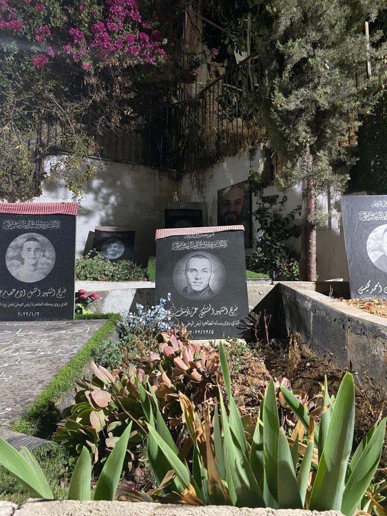 The grave of Omar Manna, Adam Ayyad, and the other Martyr's of Dheisheh refugee camps, 2026. (Photo courtesy of the authors)