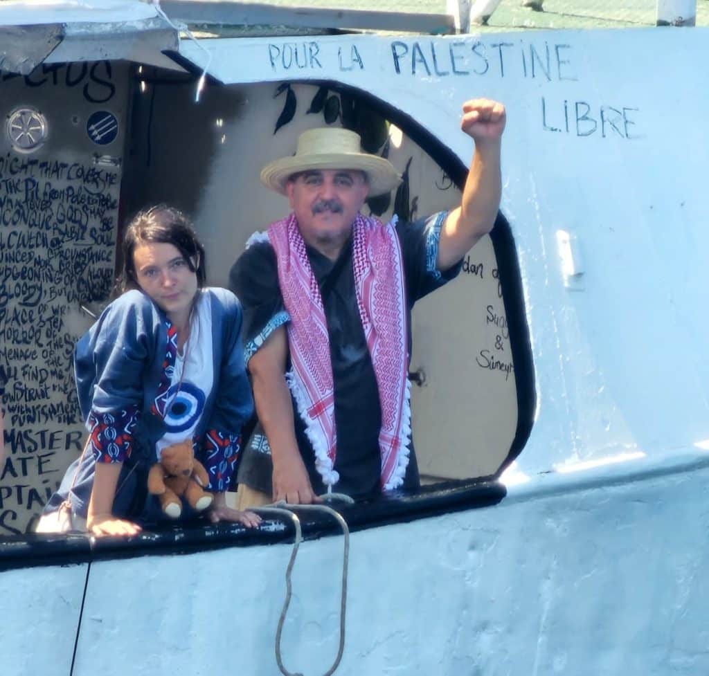 Hatem Aouini with Chloe Ludden aboard the Handala
