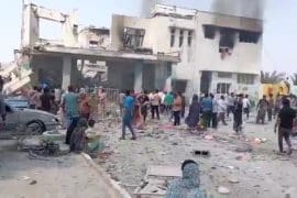 Iranians at a girl's elementary school in Minab, following a devastating airstrike that killed over 140 people, including many schoolchildren. (Source: Social Media)