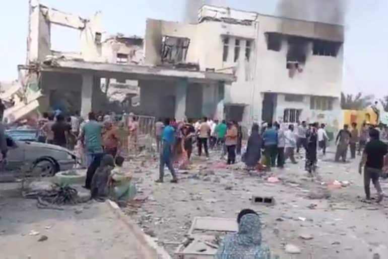 Iranians at a girl's elementary school in Minab, following a devastating airstrike that killed over 140 people, including many schoolchildren. (Source: Social Media)