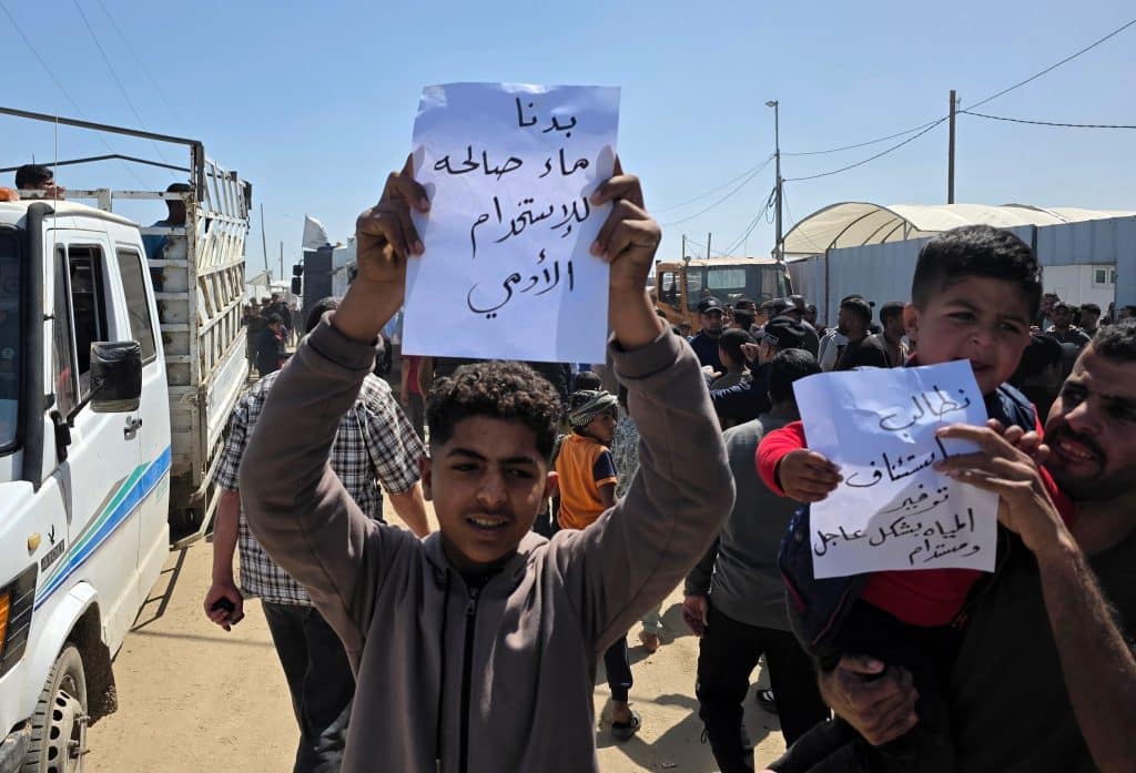 Displaced Palestinians participate in a protest south of Khan Younis, demanding clean drinking water, April 5, 2026. (Photo: Tariq Mohammad/APA Images)