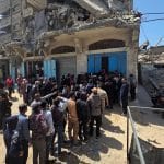 Palestinians linedup to obtain bread at a local bakery amid bread shortages in Gaza following the restriction of the entry of aid into the Strip in light of the U.S.-Israeli war on Iran, April 6, 2026. (Photo: Tariq Mohammad/APA Images)