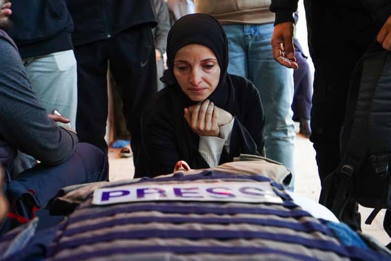 Mourners attend the funeral of Al Jazeera journalist Mohammad Weshah, who was killed in an Israeli strike on Wednesday, according to medics, at Al-Aqsa Martyrs Hospital in Deir al-Balah, central Gaza Strip, April 9, 2026. (Photo: Ramzi Abu Amer/APA Images)