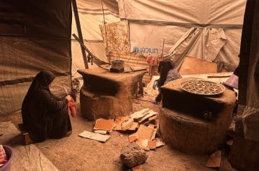 Palestinian women, including widows of people killed by the Israeli genocide in Gaza, prepare Maamoul biscuits before Eid al-Fitr in displacement camps, Nuseirat refugee camp, central Gaza, March 15, 2026. (Photo: Moiz Salhi/APA Images)