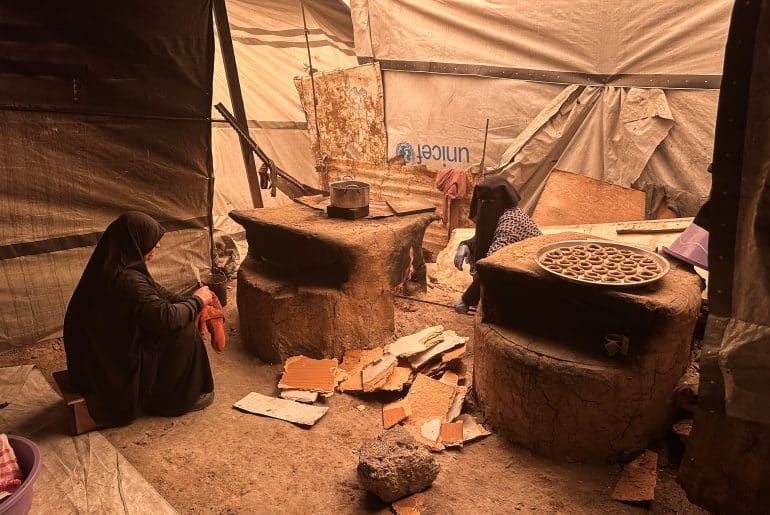 Palestinian women, including widows of people killed by the Israeli genocide in Gaza, prepare Maamoul biscuits before Eid al-Fitr in displacement camps, Nuseirat refugee camp, central Gaza, March 15, 2026. (Photo: Moiz Salhi/APA Images)