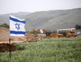 Jewish Israeli settlers set up mobile homes and raise Israeli flags over the evacuated settlement of Sanur, north of Nablus, which was approved by resettlement by the Israeli government in 2025, March 18, 2026. (Photo: Mohammed Nasser/APA Images)