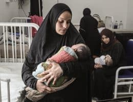 Yasmeen al-Jamala holds her newborn son, Adam al-Ustaz, who receives treatment at al-Rantisi Children's Hospital in Gaza City after being bitten by a rat inside a displacement tent, March 28, 2026. (Photo: Moiz Salhi/APA Images)
