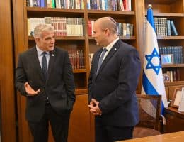 Naftali Bennett, right, and Yair Lapid, left, prepare to rotate the prime ministership during their first unity effort, on June 30, 2022. (Photo: Koby Gideon/Israel Gpo via ZUMA Press Wire/APA Images)